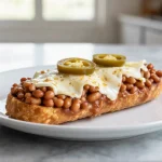 Delicioso mollete en freidora de aire, ideal para disfrutar en cualquier momento.